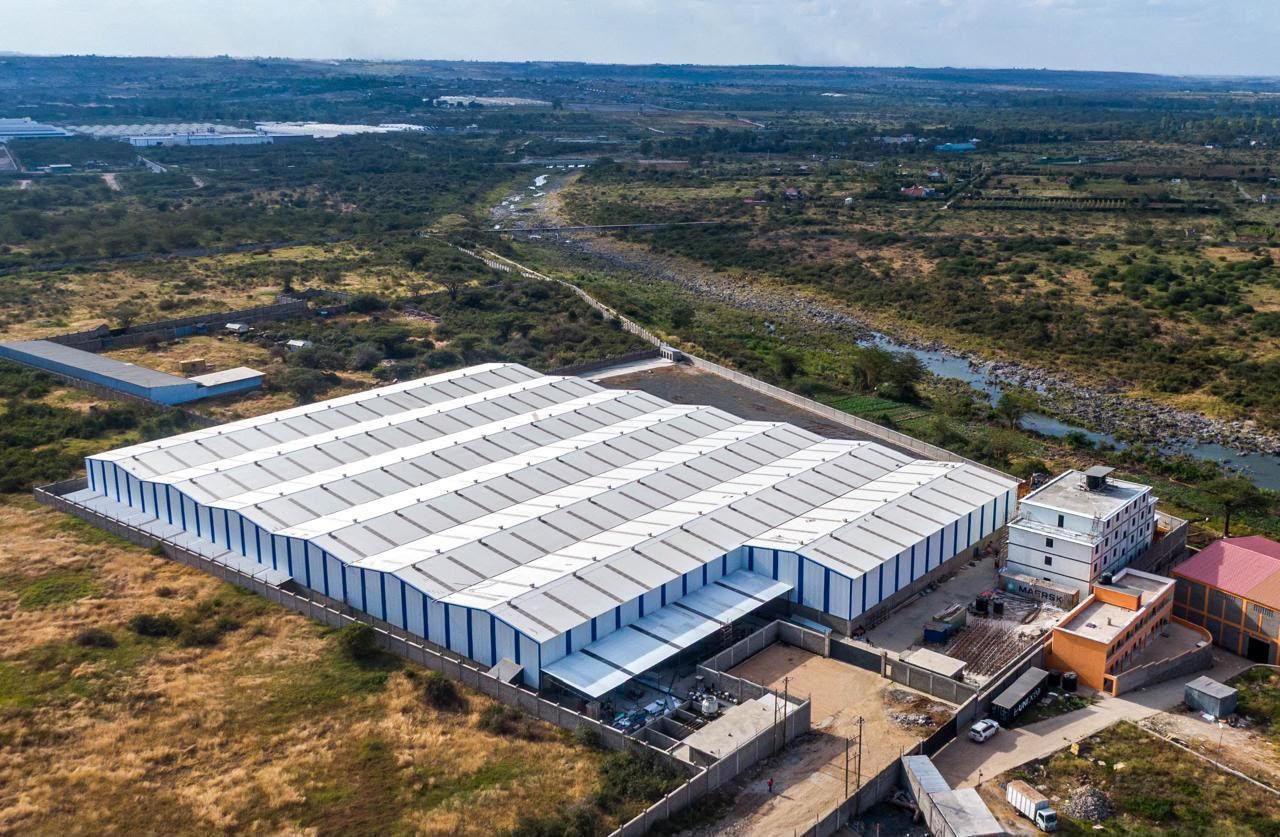 Aerial view of a white Muwi factory roof