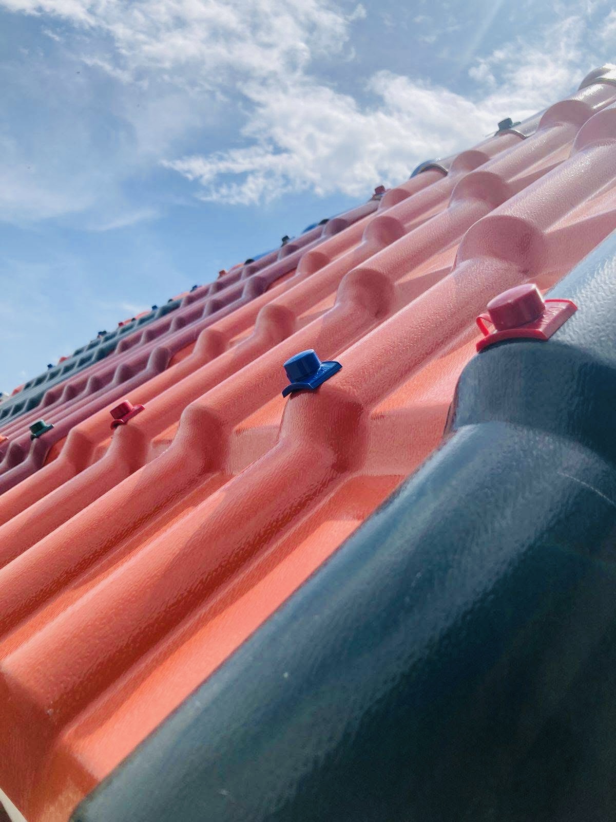 Close-up of orange Muwi synthetic resin tiles