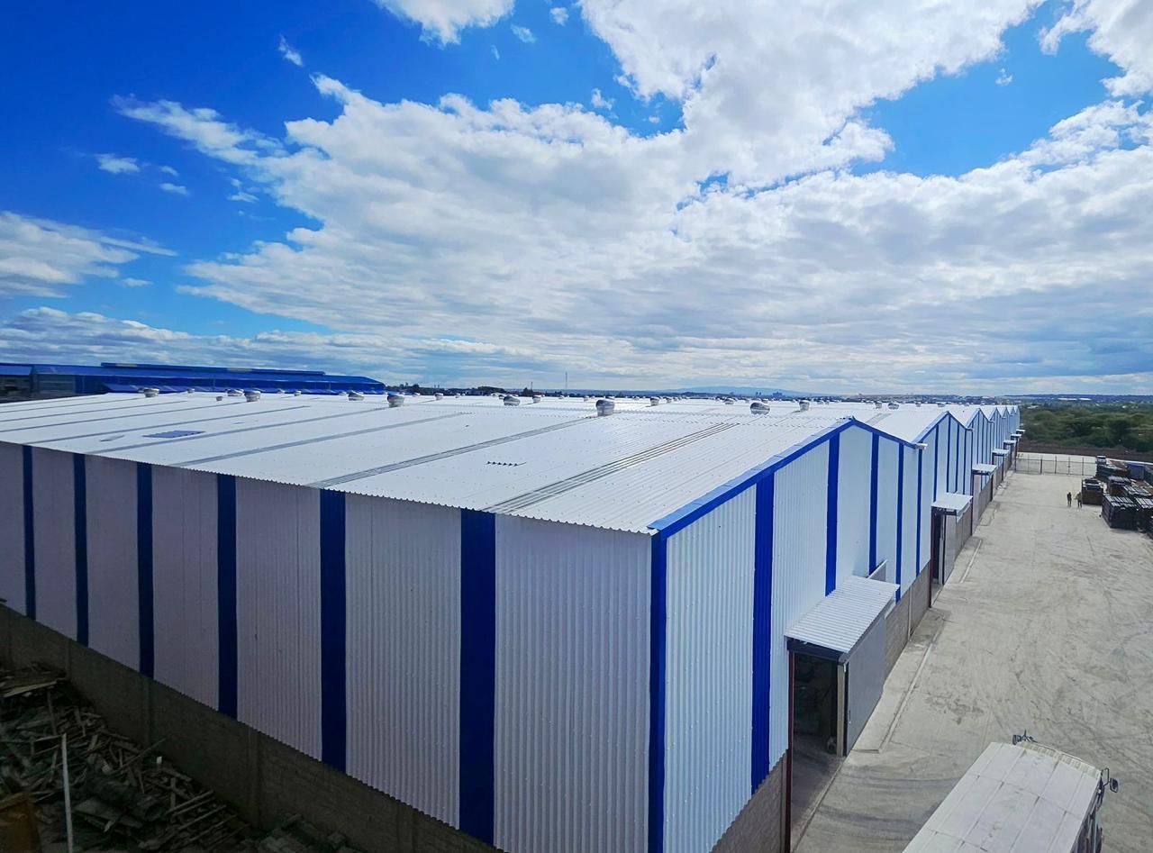 Row of blue and white Muwi ACT warehouses