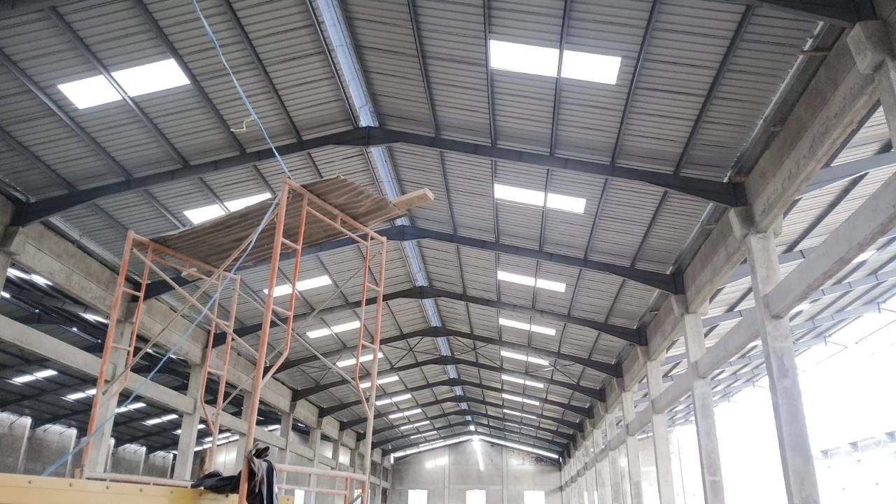 Warehouse interior daylit by Muwi polycarbonate skylights